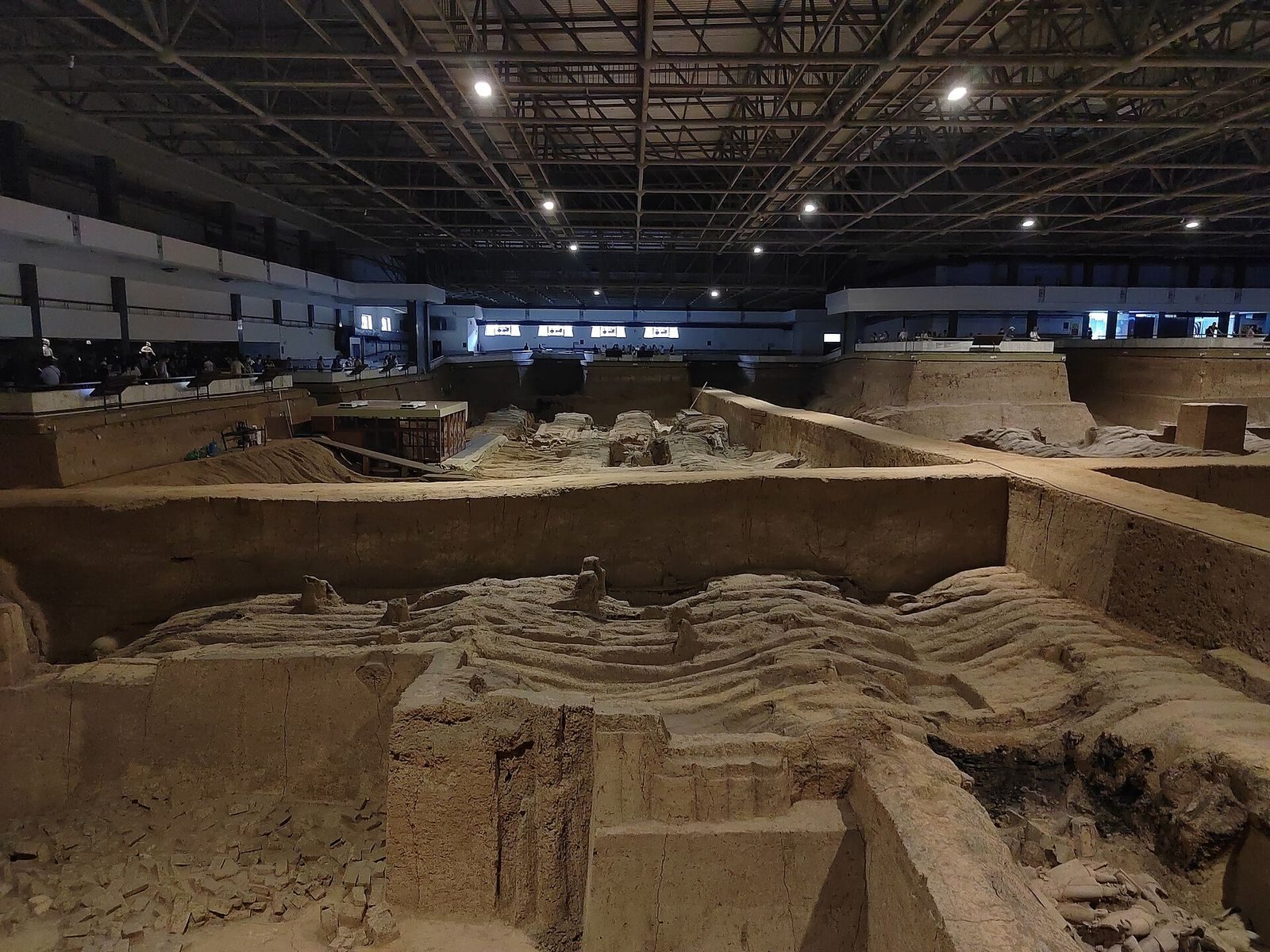 Rows of terracotta warriors standing in the excavation pit of the First Emperor's tomb at Xi'an
