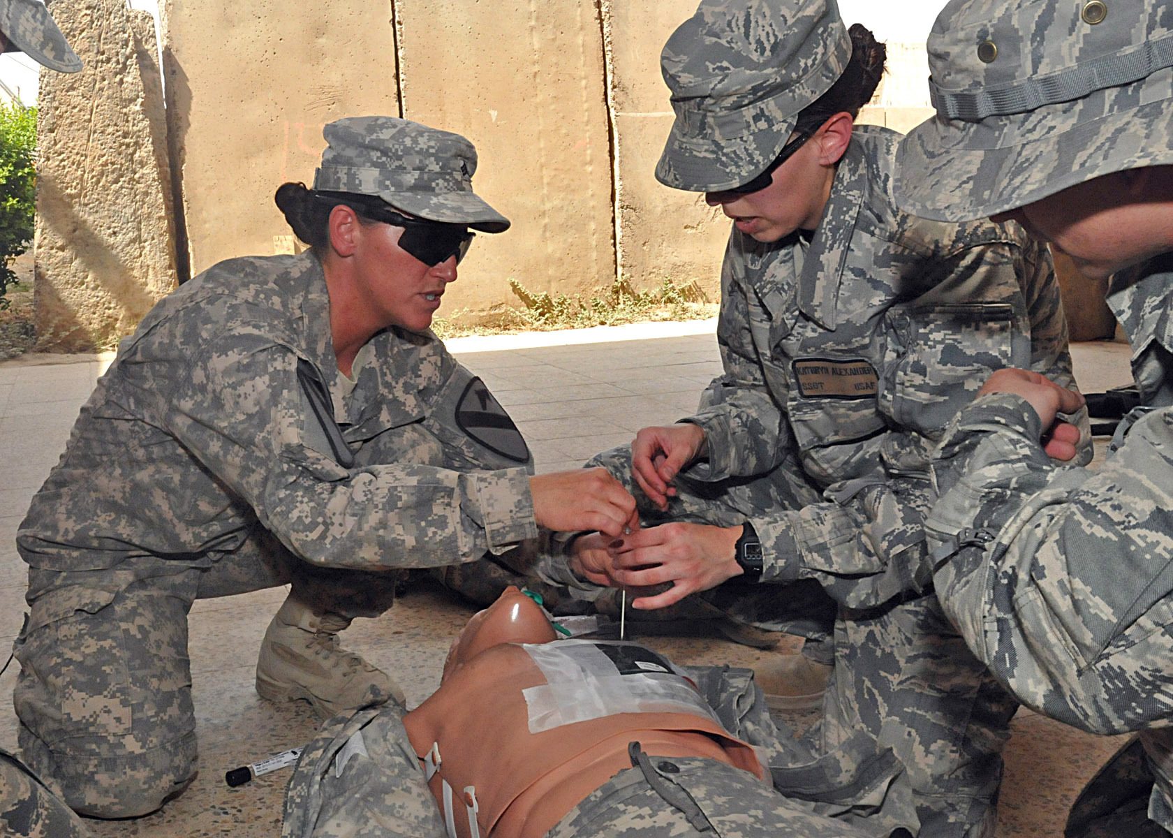 US personnel at a base in Iraq — a combat medic assisting airmen at Contingency Operating Site Marez